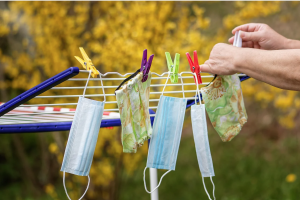 Hanging face masks on a clothes line