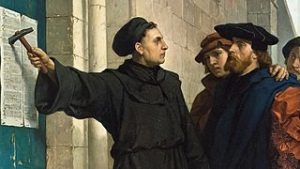 Image of Martin Luther nailing his 95 Theses to the door of the All Saints' Church