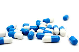 a group of blue and white pills